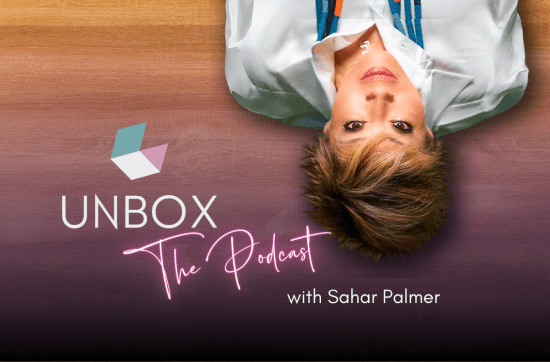 Sahar lying upside down announcing Unbox The Podcast